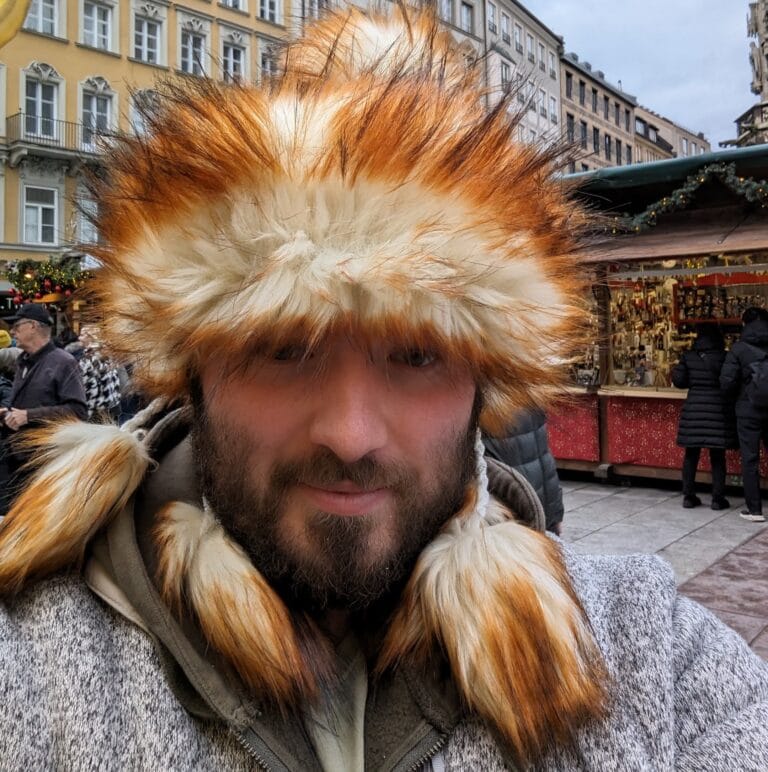 Picture of Keiran. Bald and bearded, very British